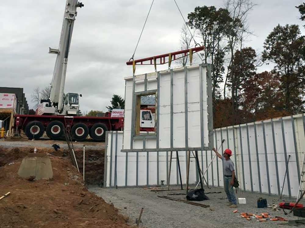 precast walls being lowered into place